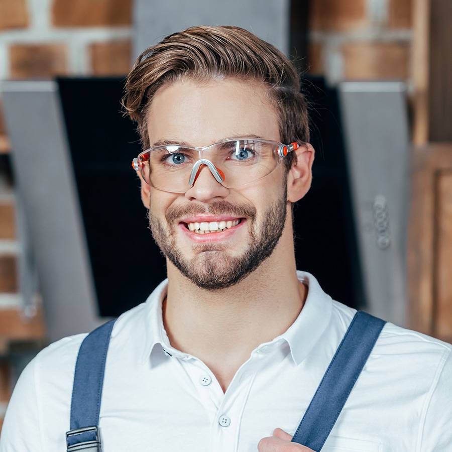 handsome-young-repairman-holding-adjustive-wrench-THQGYPF.jpg